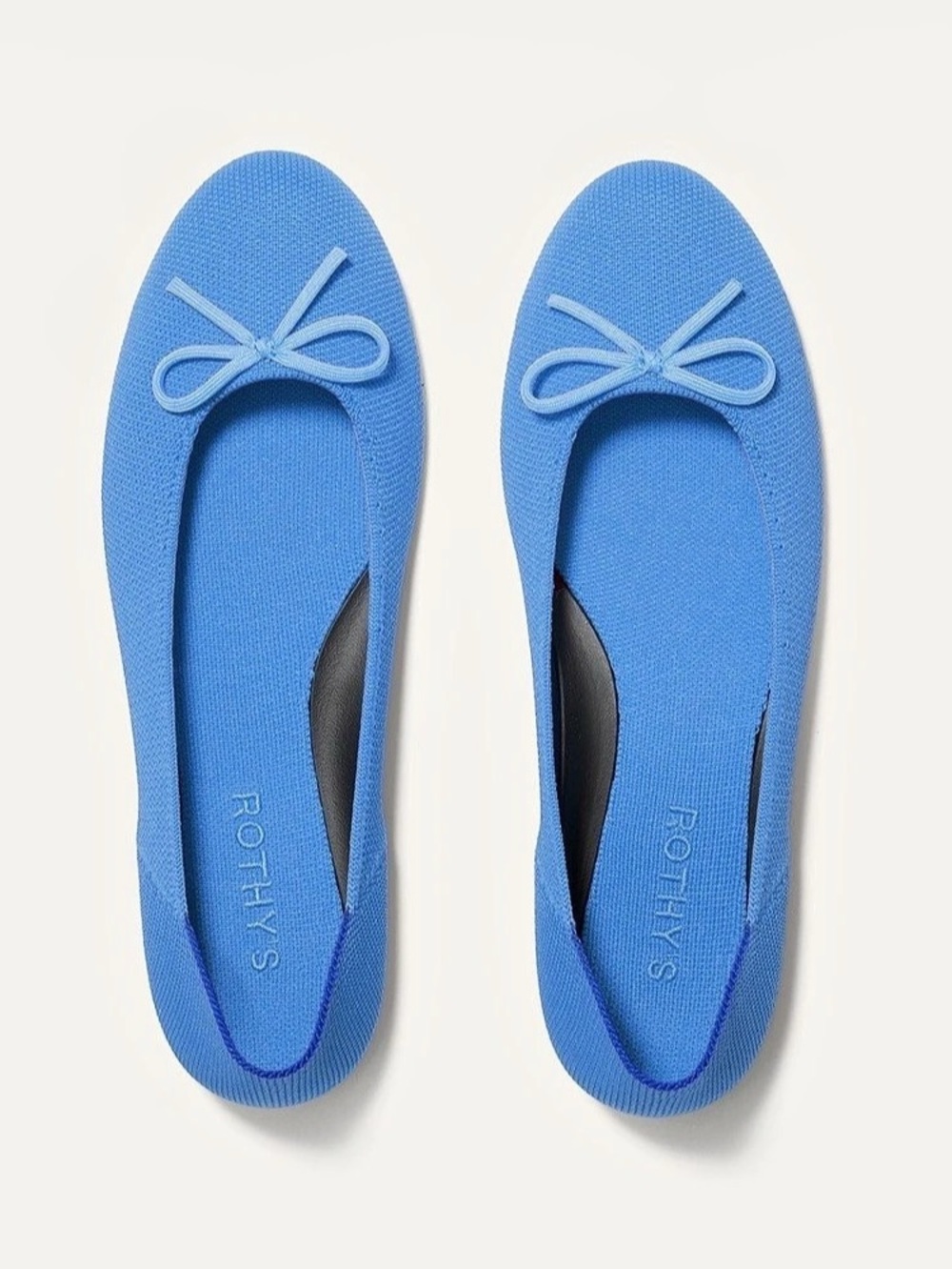Rothy’s sky blue knit ballet flats with bow. Removable cushion comfort insole.